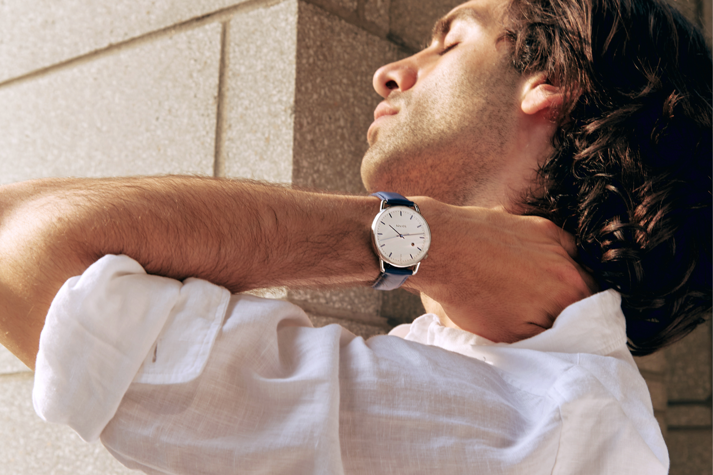 Solar powered watch on men's wrist